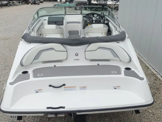 Slide: The Image of Rear view of a 2018 Yamaha SX190 boat on gravel. - 23