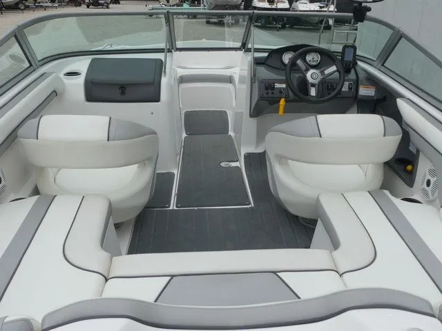 Slide: The Image of Interior of a 2018 Yamaha SX190 boat with white seating. - 26