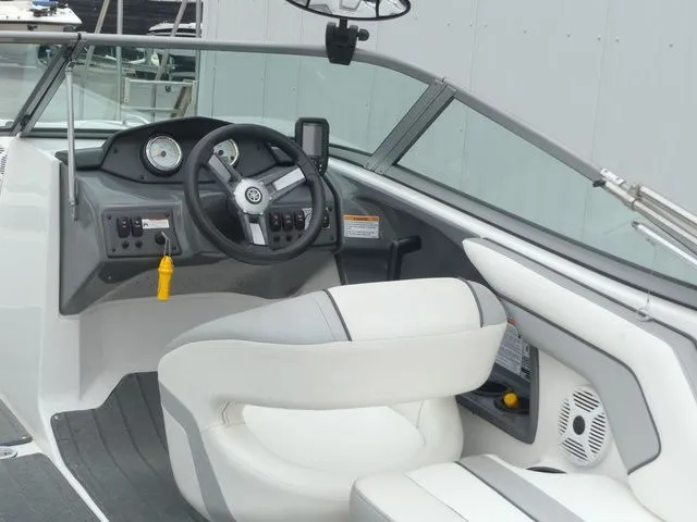 Slide: The Image of Interior of a 2018 Yamaha SX190 boat with steering console. - 28