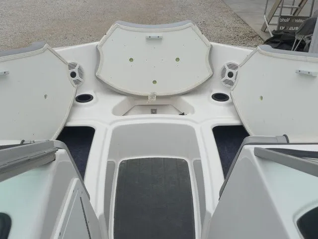 Slide: The Image of Interior view of a 2018 Yamaha SX190 boat with open storage compartments. - 32