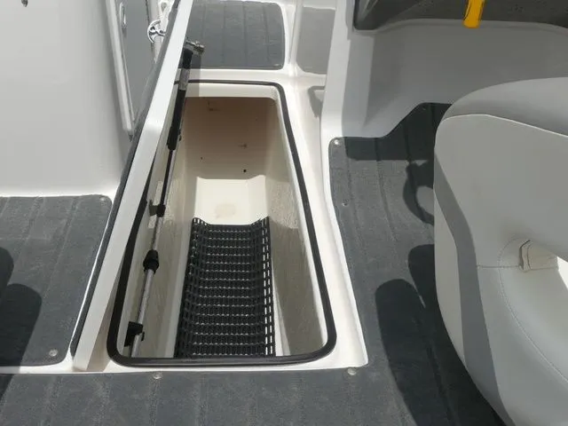 Slide: The Image of 2018 Yamaha SX190 boat with open storage compartment. - 35