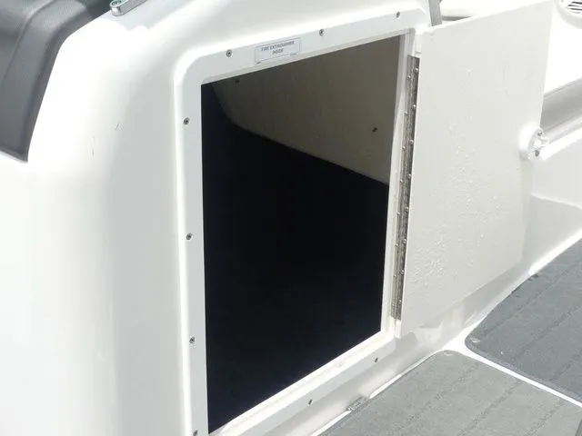 Slide: The Image of Open storage compartment on a 2018 Yamaha SX190 boat. - 36