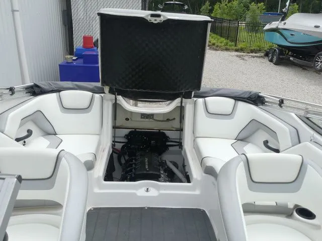 Slide: The Image of Interior view of a 2018 Yamaha SX190 boat with open engine compartment. - 41