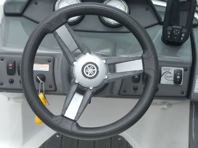 Slide: The Image of Steering wheel of a 2018 Yamaha SX190 boat with dashboard. - 44