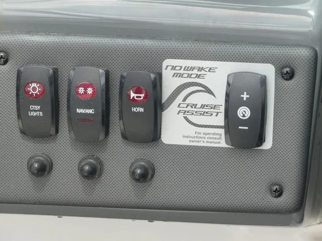 Slide: The Image of Control panel of 2018 Yamaha SX190 boat with switches for lights and horn. - 46