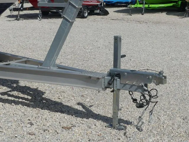 Slide: The Image of Regal 2500 boat trailer, 2015 model, parked on gravel surface. - 10