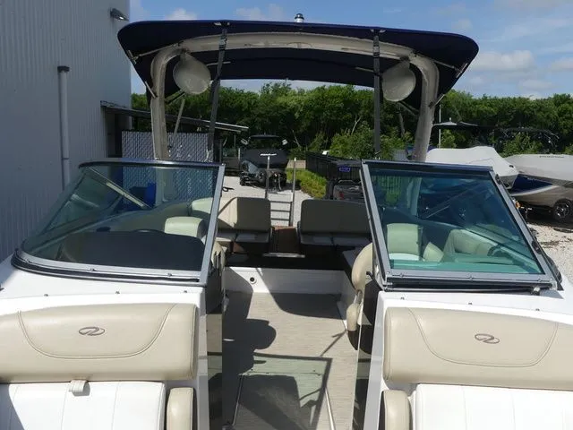 Slide: The Image of 2015 Regal 2500 boat with open cockpit and canopy. - 25