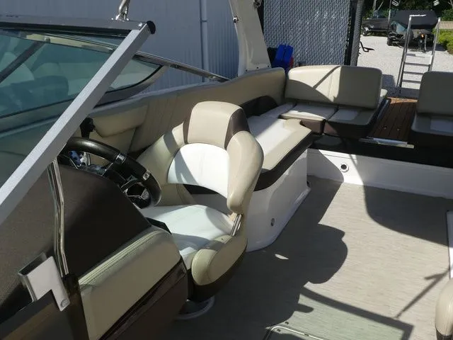 Slide: The Image of Interior of a 2015 Regal 2500 boat with beige seating. - 27