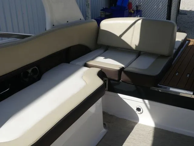Slide: The Image of Interior of a 2015 Regal 2500 boat with beige seating. - 30