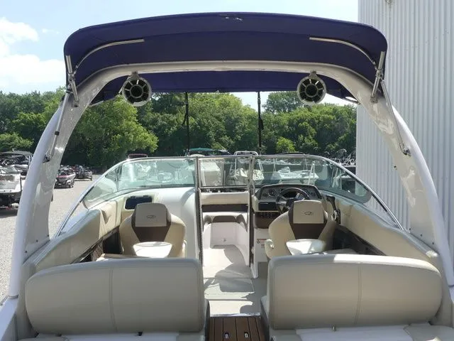 Slide: The Image of Interior view of a 2015 Regal 2500 boat with blue canopy. - 32