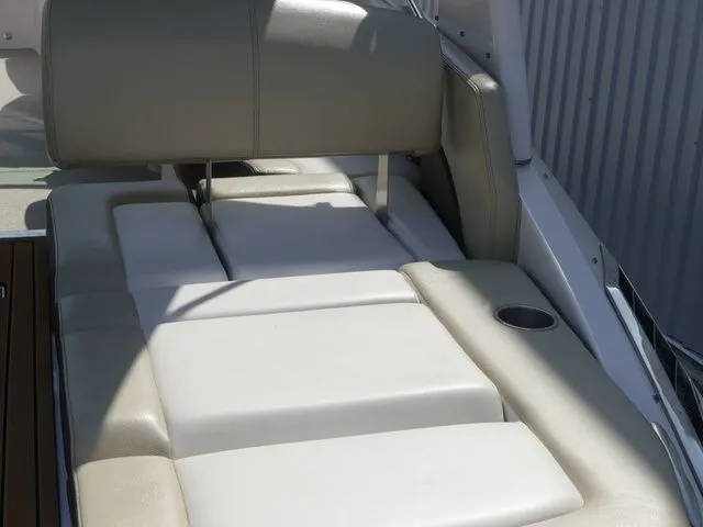 Slide: The Image of 2015 Regal 2500 boat with beige cushioned seating. - 36