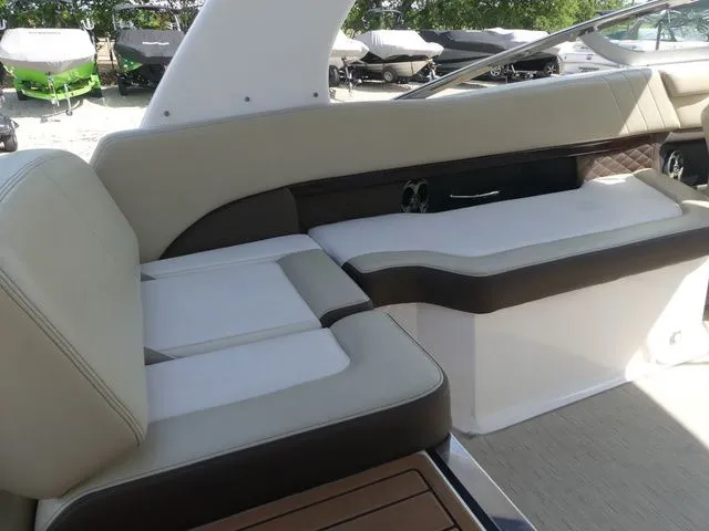 Slide: The Image of Interior of a 2015 Regal 2500 boat with beige seating. - 37