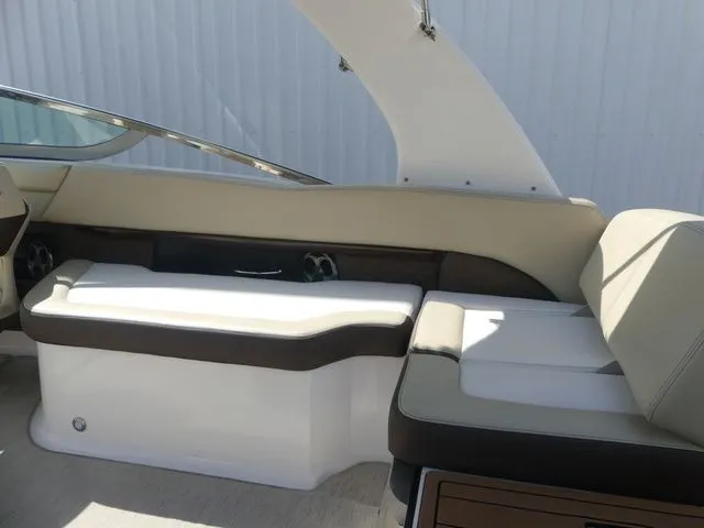 Slide: The Image of Interior of a 2015 Regal 2500 boat with beige and brown seating. - 38