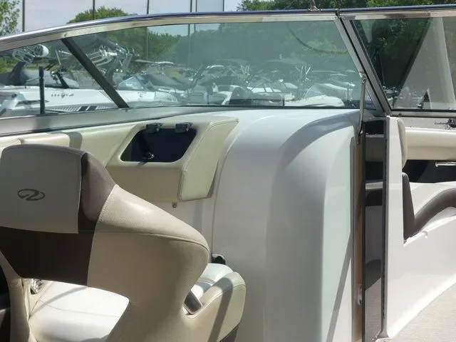 Slide: The Image of Interior of a 2015 Regal 2500 boat with beige seating. - 39