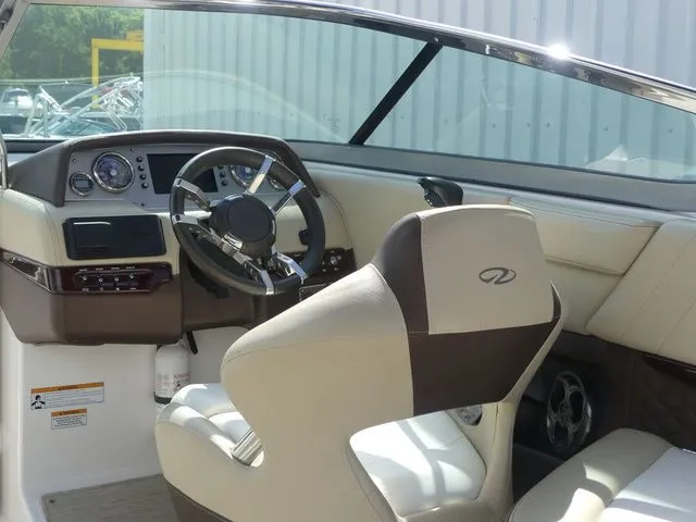 Slide: The Image of Interior of a 2015 Regal 2500 boat, featuring a modern cockpit. - 40
