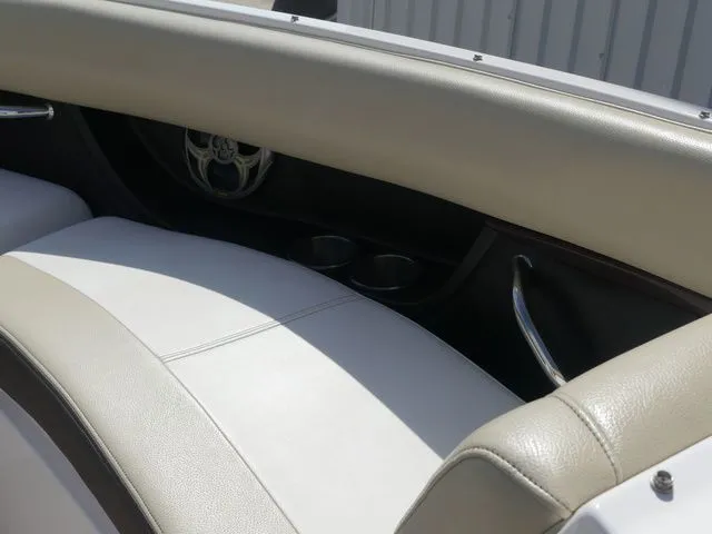 Slide: The Image of Interior of a 2015 Regal 2500 boat with beige leather seats. - 45