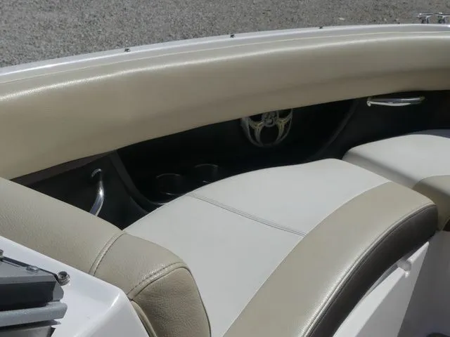Slide: The Image of Interior of a 2015 Regal 2500 boat with beige leather seating. - 46