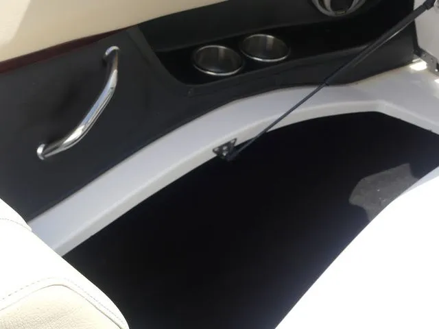 Slide: The Image of Interior of a 2015 Regal 2500 boat with cup holders. - 49