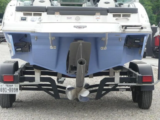 Slide: The Image of Rear view of a 2023 Chaparral 21 Surf boat on trailer. - 11