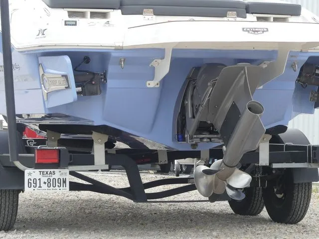 Slide: The Image of Rear view of a 2023 Chaparral 21 Surf boat on trailer. - 12