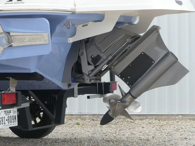 Slide: The Image of Rear view of a 2023 Chaparral 21 Surf boat with drive. - 13