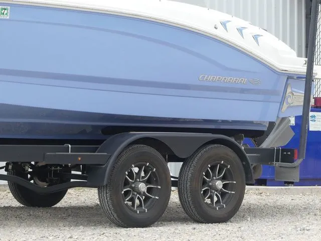 Slide: The Image of 2023 Chaparral 21 Surf boat on trailer, side view. - 14