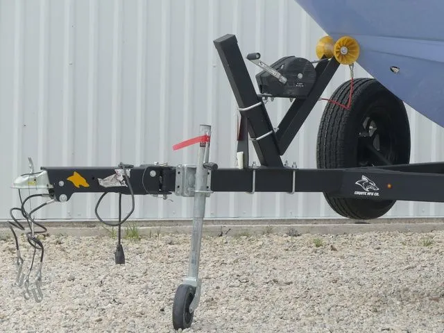 Slide: The Image of Trailer of a 2023 Chaparral 21 Surf boat on gravel surface. - 15