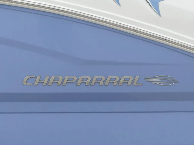 Slide: The Image of Chaparral 21 Surf 2023 boat logo on blue background. - 16