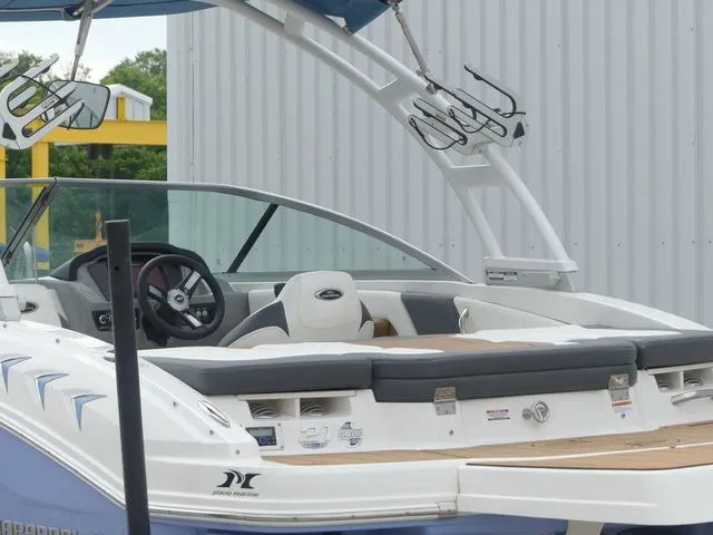 Slide: The Image of 2023 Chaparral 21 Surf boat with modern design and features. - 18