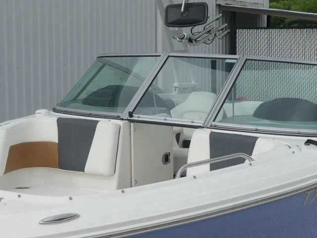Slide: The Image of 2023 Chaparral 21 Surf boat with sleek design. - 21