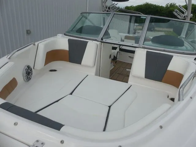 Slide: The Image of Interior of 2023 Chaparral 21 Surf boat with luxurious seating. - 23