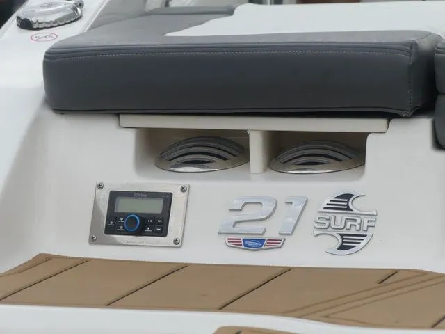Slide: The Image of 2023 Chaparral 21 Surf boat stern with speakers and controls. - 44