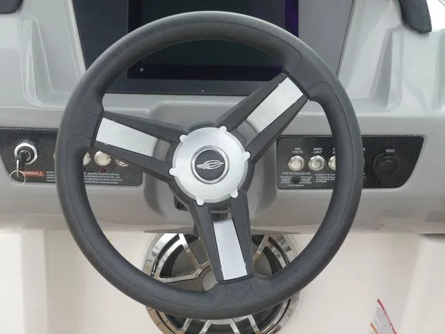 Slide: The Image of Steering wheel of 2023 Chaparral 21 Surf boat, close-up. - 46