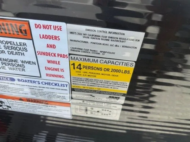 Slide: The Image of Safety and capacity labels on a 2023 Bennington 25 RTSB boat. - 15