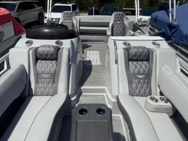 Slide: The Image of Interior of a 2023 Bennington 25 RTSB pontoon boat with luxurious seating. - 2