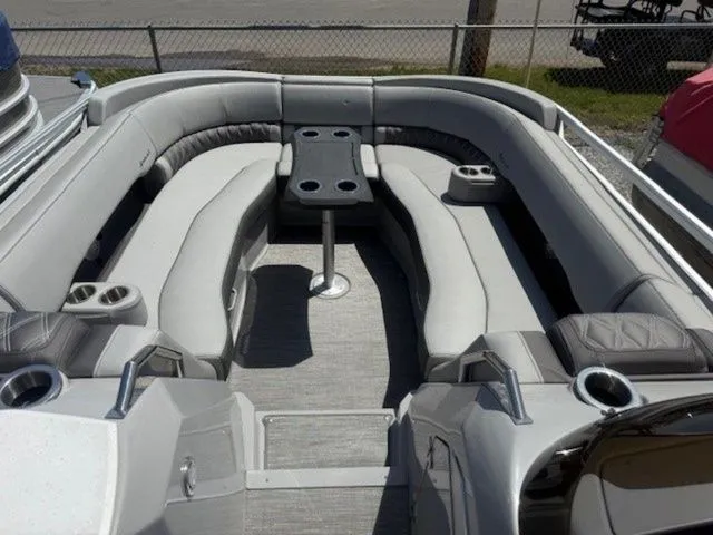 Slide: The Image of Interior of a 2023 Bennington 25 RTSB pontoon boat with gray seating. - 7