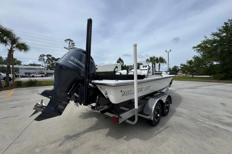 Slide: The Image of 2021 Blazer Bay 2220 GTS boat with Yamaha engine on trailer in parking lot. - 10