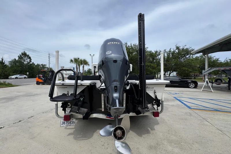 Slide: The Image of 2021 Blazer Bay 2220 GTS boat with powerful outboard motor in parking lot. - 12
