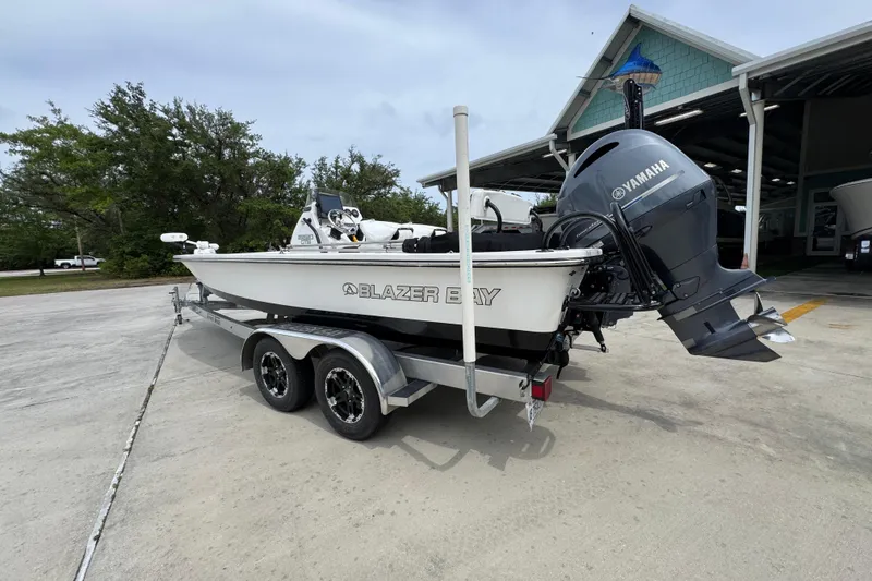 Slide: The Image of 2021 Blazer Bay 2220 GTS boat on trailer with Yamaha outboard motor. - 14