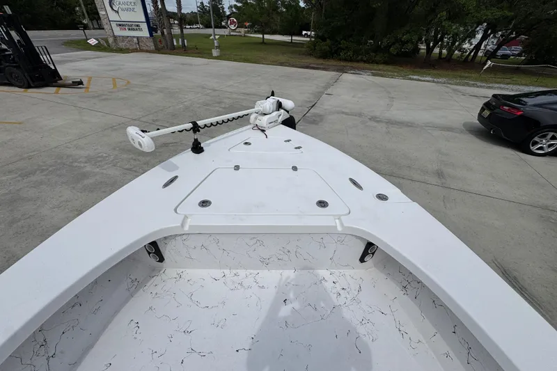 Slide: The Image of 2021 Blazer Bay 2220 GTS boat with trolling motor in parking lot. - 16