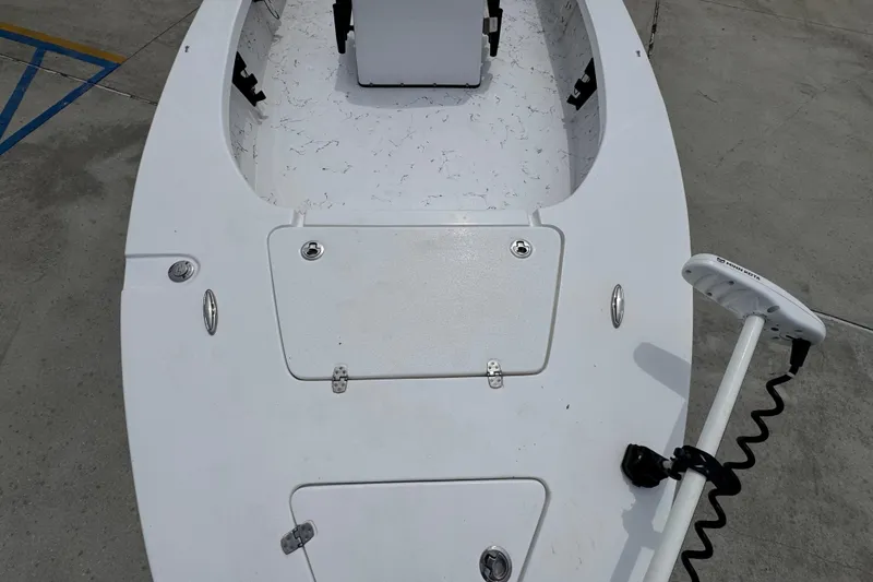 Slide: The Image of 2021 Blazer Bay 2220 GTS boat deck with storage compartments and trolling motor. - 19