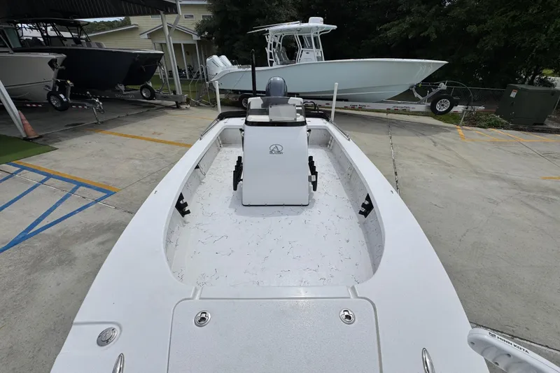 Slide: The Image of 2021 Blazer Bay 2220 GTS boat on display in a marina setting. - 20
