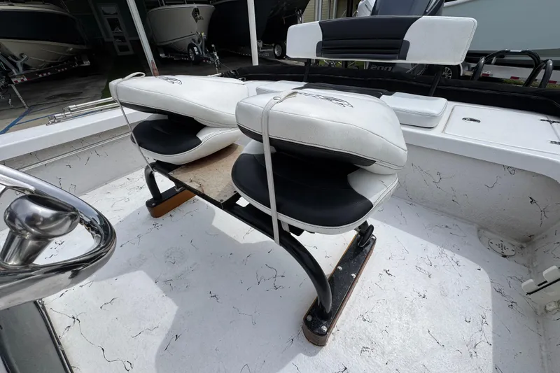 Slide: The Image of 2021 Blazer Bay 2220 GTS boat interior with cushioned seating and steering wheel. - 24