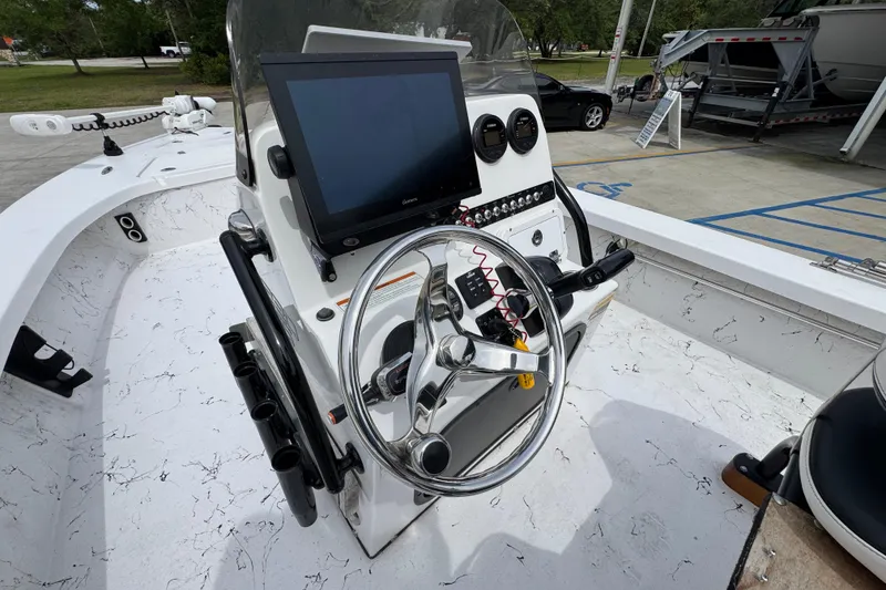 Slide: The Image of 2021 Blazer Bay 2220 GTS boat console with steering wheel and navigation screen. - 26