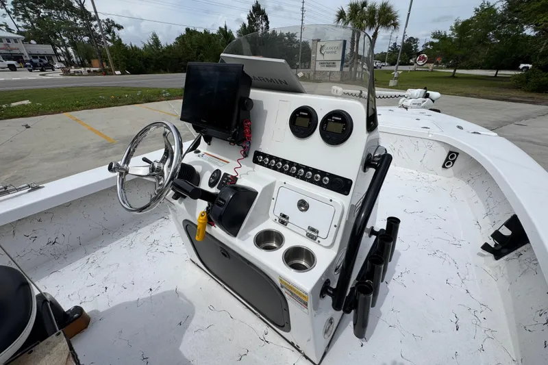 Slide: The Image of 2021 Blazer Bay 2220 GTS boat console with steering wheel and navigation equipment. - 28