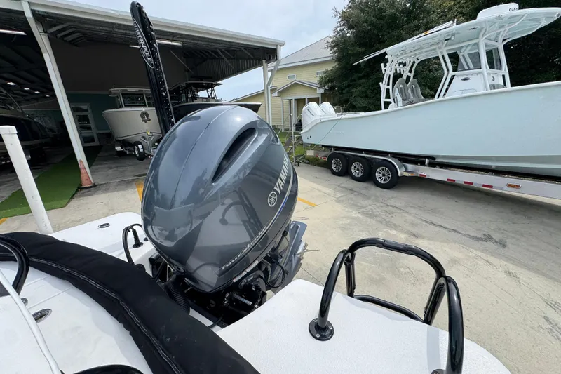 Slide: The Image of 2021 Blazer Bay 2220 GTS with Yamaha outboard motor in a boatyard. - 33
