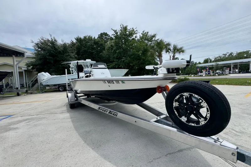 Slide: The Image of 2021 Blazer Bay 2220 GTS boat on trailer in parking lot. - 6