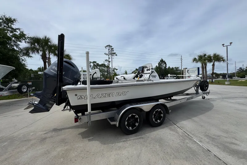 Slide: The Image of 2021 Blazer Bay 2220 GTS boat on trailer, parked outdoors. - 9