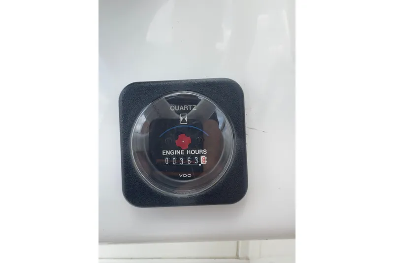 Slide: The Image of Engine hour meter displaying 363.8 hours on a 1995 Wellcraft Scarab 31 boat. - 10