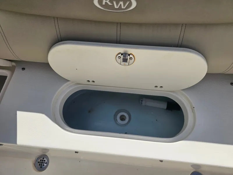 Slide: The Image of 2024 Key West 239 FS boat, open storage compartment. - 11